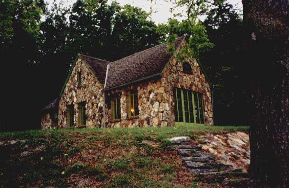 The rock wall in front of the house