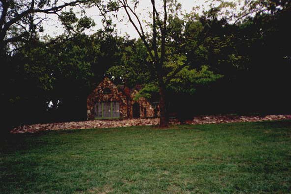 The rock wall in front of the house
